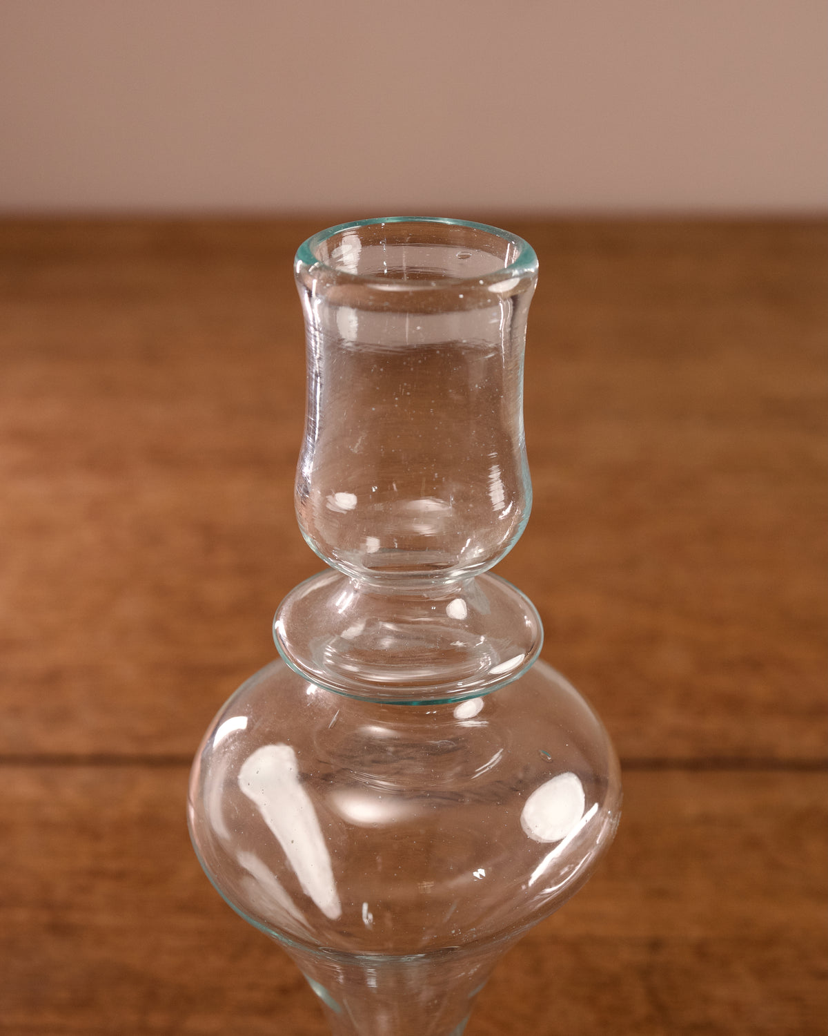 Clear glass vase on a wooden surface