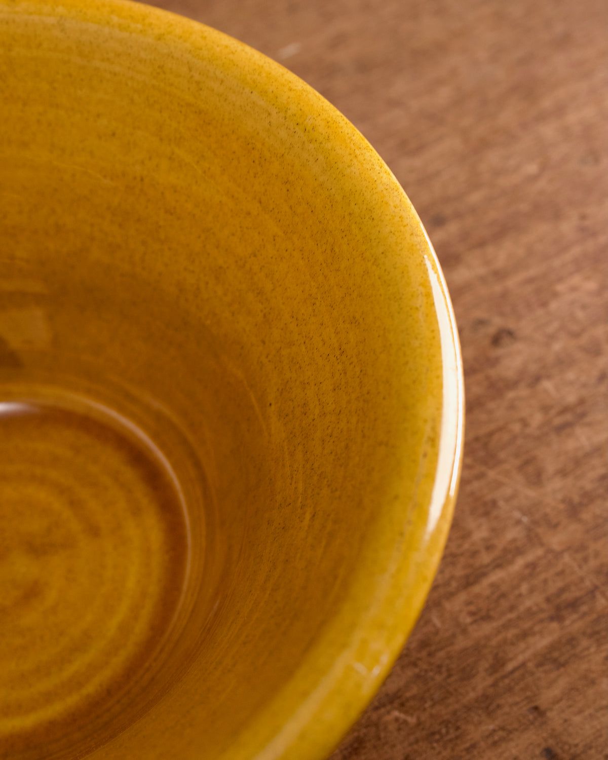 Honey glazed salad bowl on a wooden surface