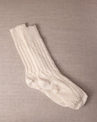 White socks on a beige textured background