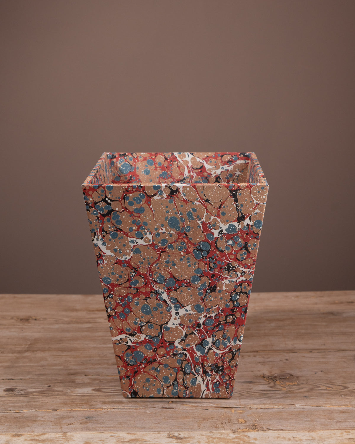 Wastepaper bin covered with marbled paper, office bin