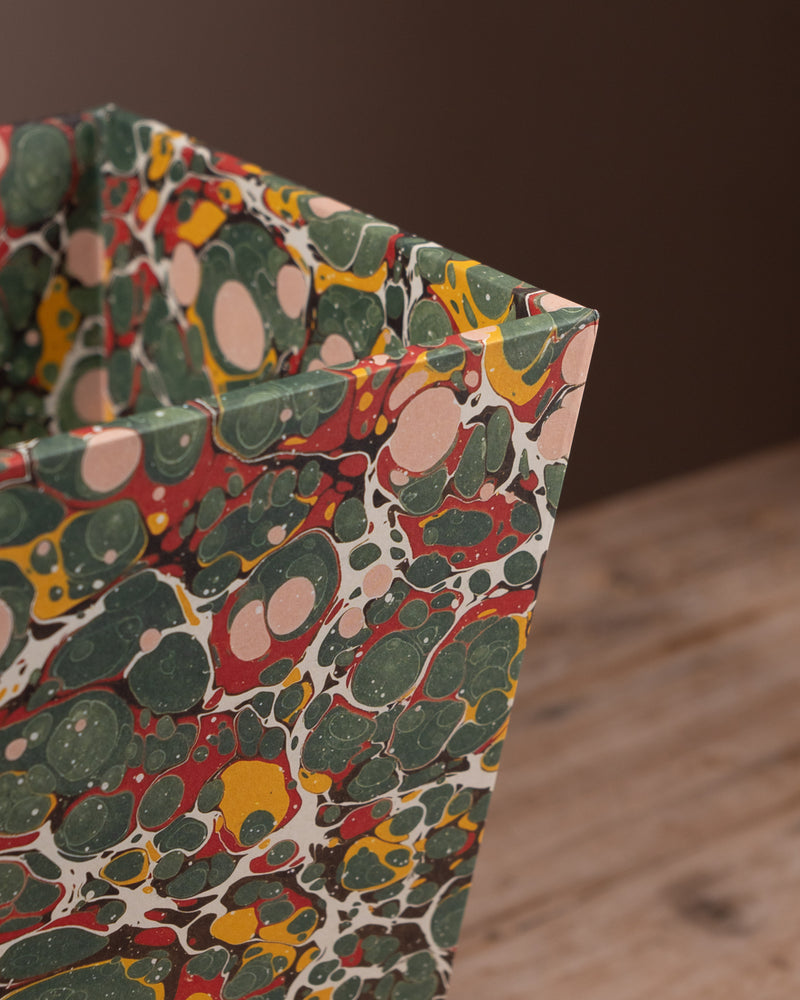 Office bin covered in marbled paper
