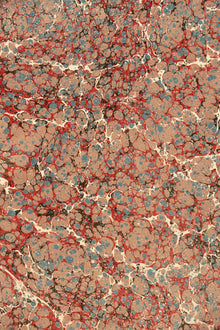 Marbled wrapping paper with red, brown, and beige colors