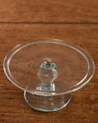 Clear glass candle holder on a wooden surface