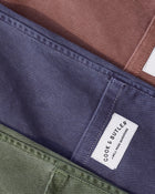 Close-up of a label on a piece of clothing with 'Cook & Butler' branding.