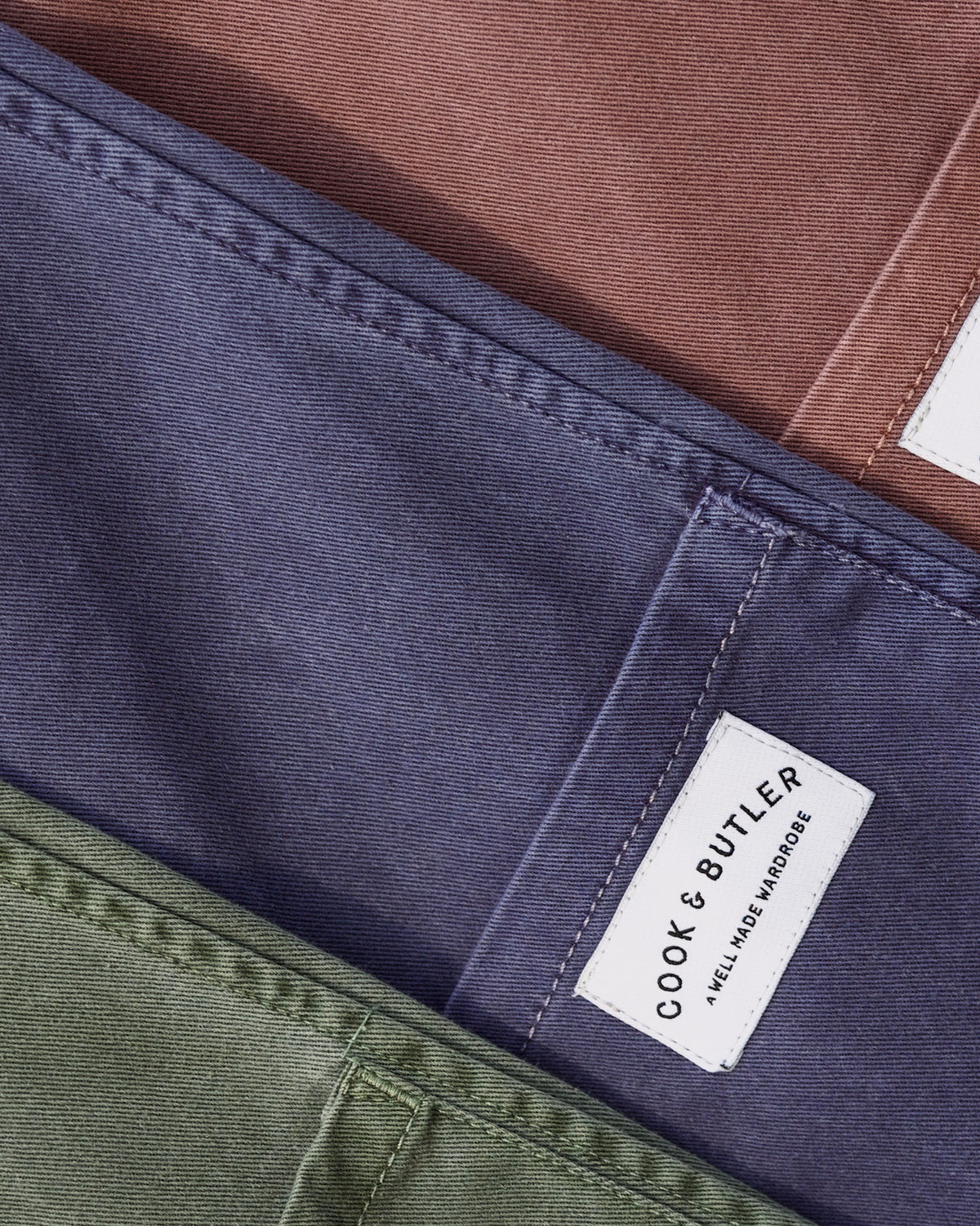 Close-up of a label on a piece of clothing with 'Cook & Butler' branding.