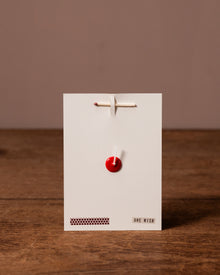 white card with 'One Wish' branding against a brown background